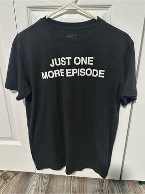 Mighty Fine Black Tee with White "Just One More Episode" Graphic